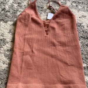 Free people intimately top w mesh cleavage area.